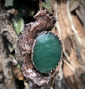 magical pendant with copper over wood with green aventurine